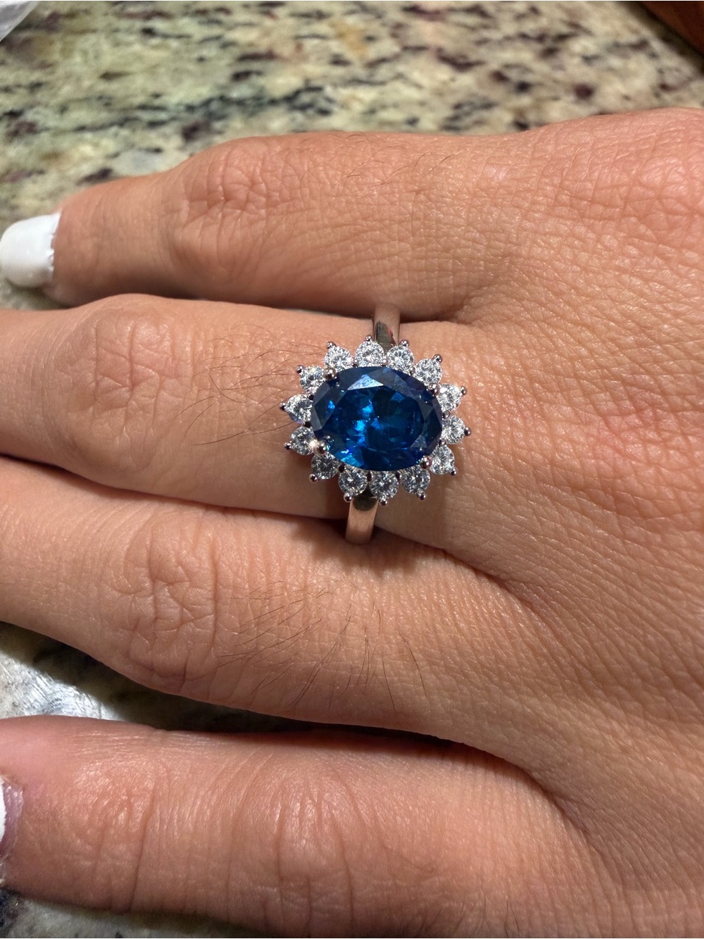 Blue Halo Sapphire Ring with moissanite diamond accents. Sterling silver 3CT